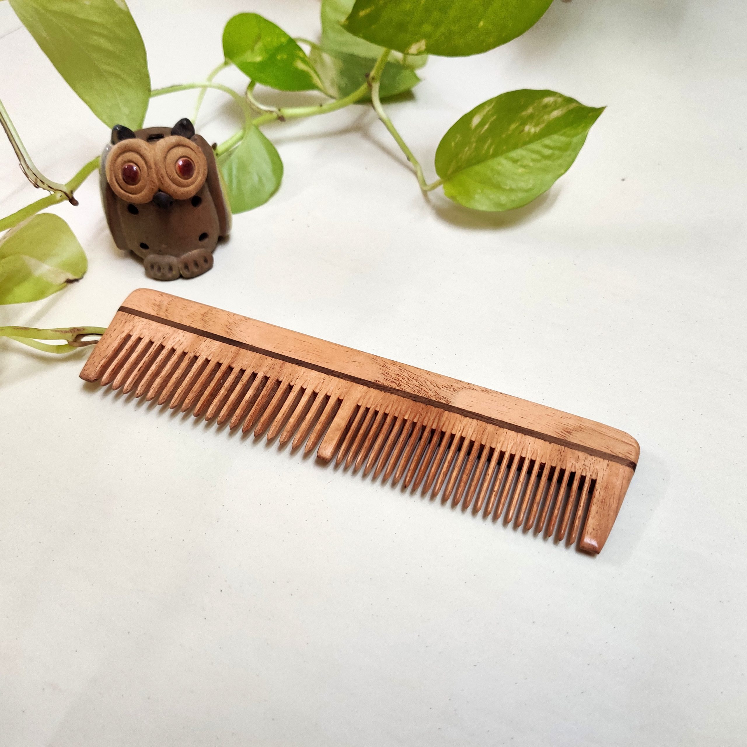 Dual teeth comb made with neem