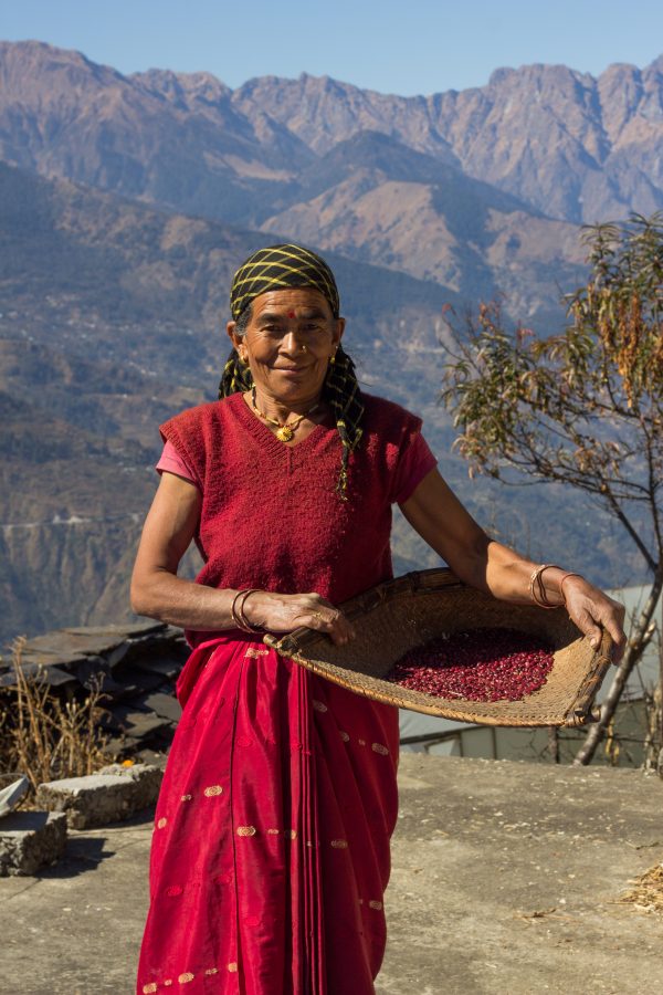 woman with organic red rajma in hills